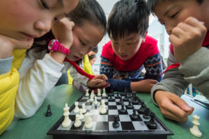 Chengdu Sichuan province China - March 31 2017: children playing chess in a school Chengdu Sichuan Province China