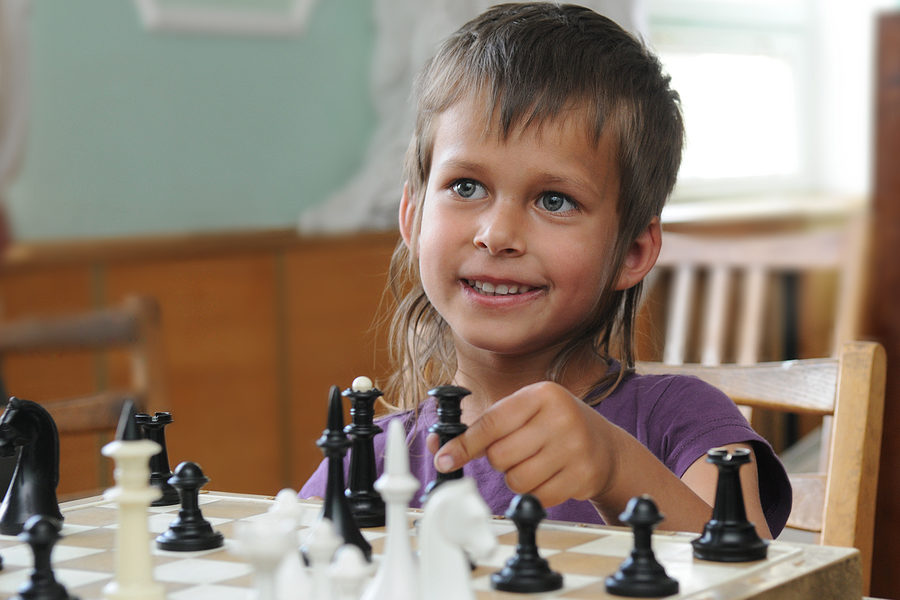 boy playing chess