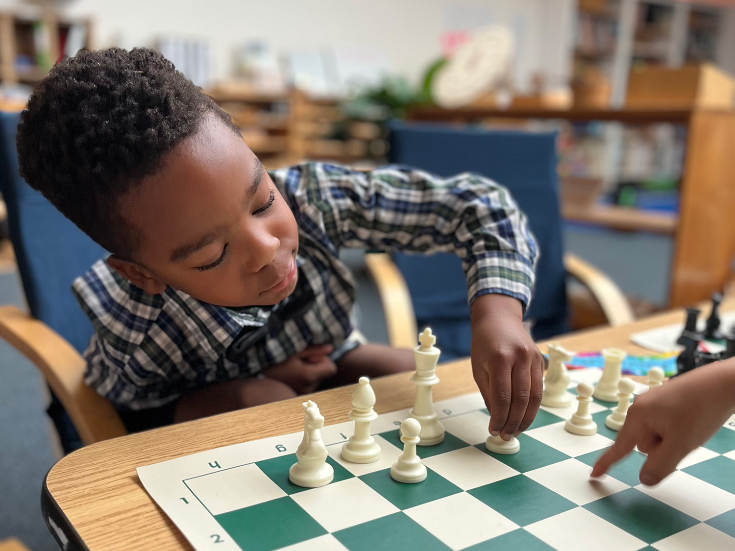 African American boy playing chess