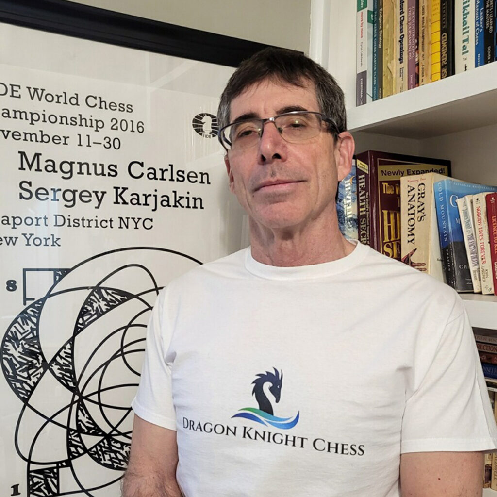 Paul Ascolese wearing a Dragon Knight Chess shirt